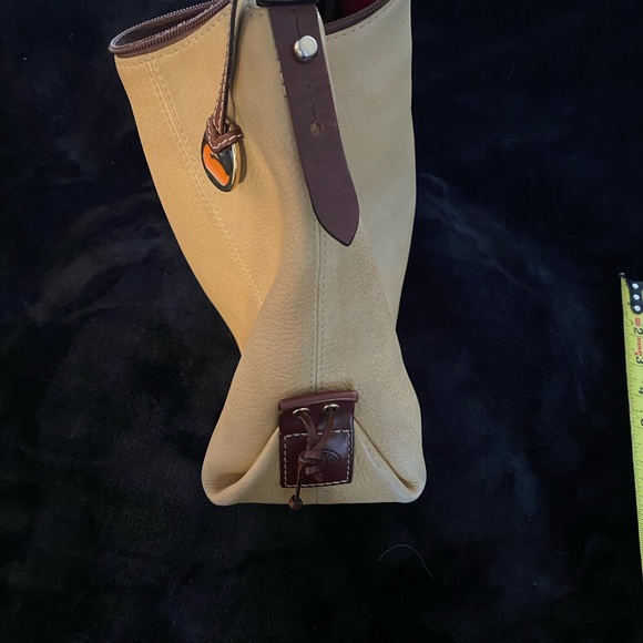 Dooney and Bourke bag. Soft tan/golden color with red interior - Picture 6 of 10